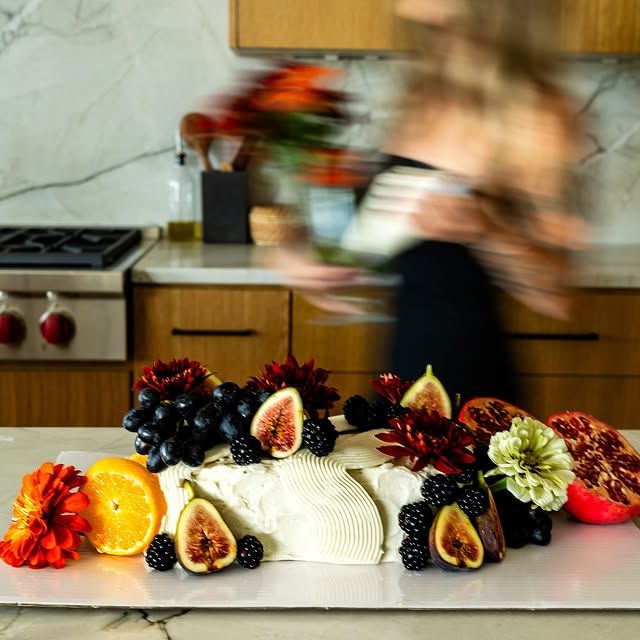 Cake-scape spread with a cake, fresh figs, blackberries and flowers, Austin TX